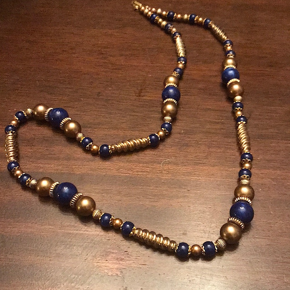 30” necklace. Gold and navy various size beads.